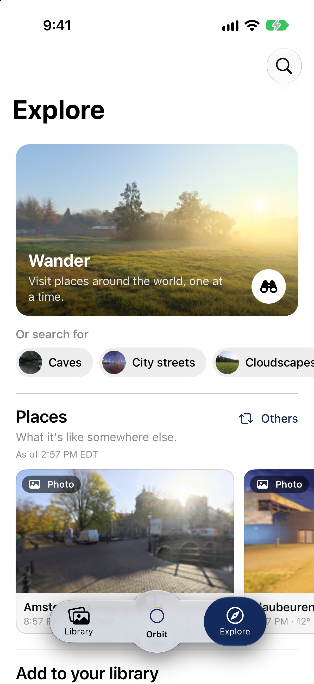 The Explore tab on iPhone: the Wander tile at the top, search ideas under it, then Places, with Orbit in the center of the tab bar